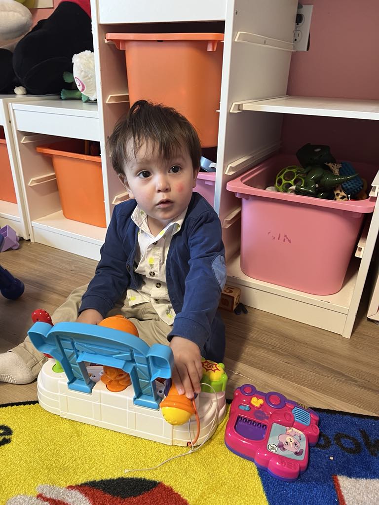 Toddlers playing with colorful blocks